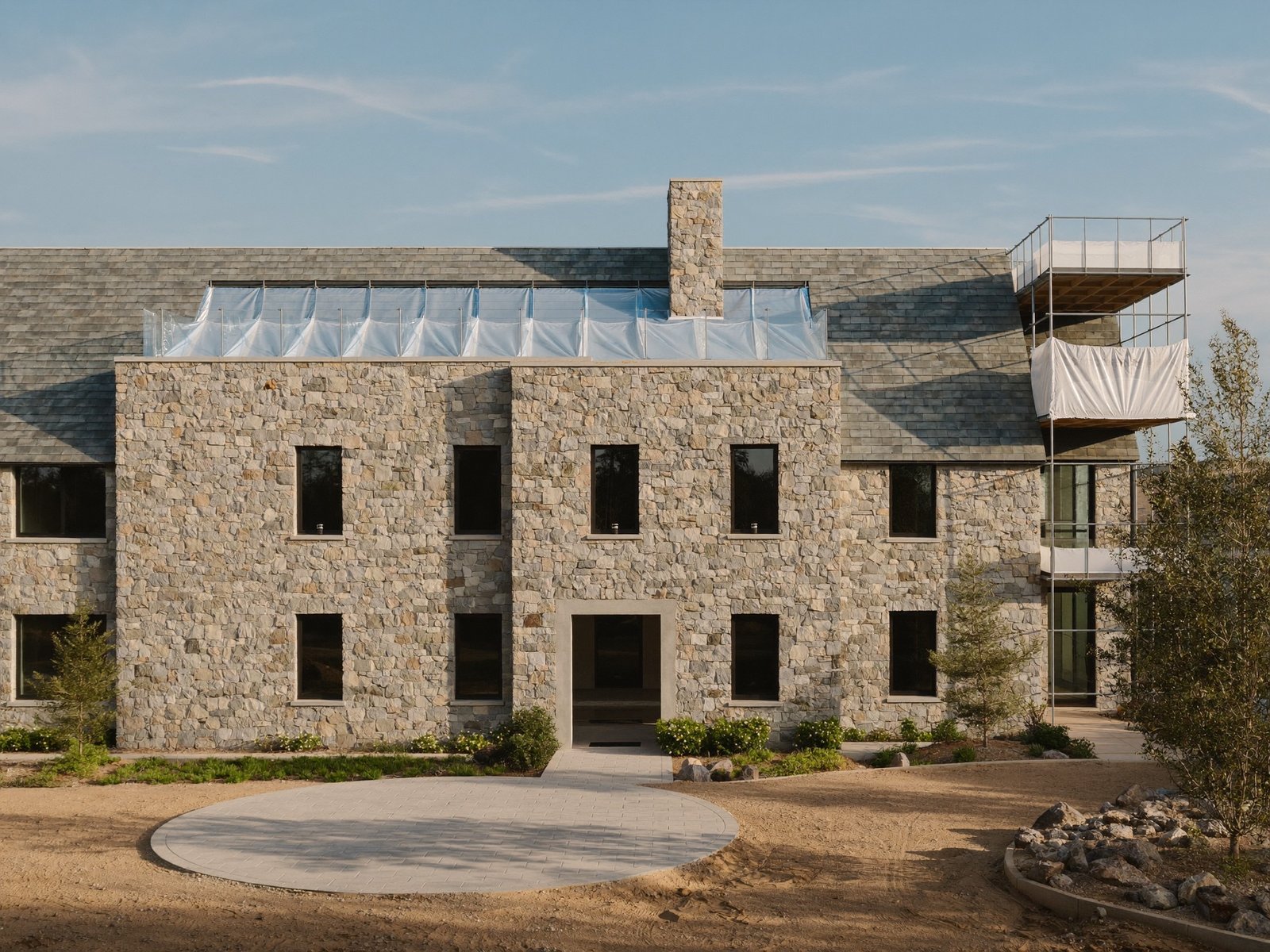 New custom estate with cast stone facade under construction in Preston Hollow, Dallas