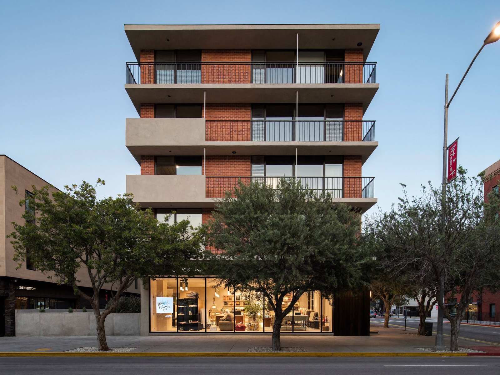 Five-story mixed-use building with ground-floor retail on Broadway in San Antonio