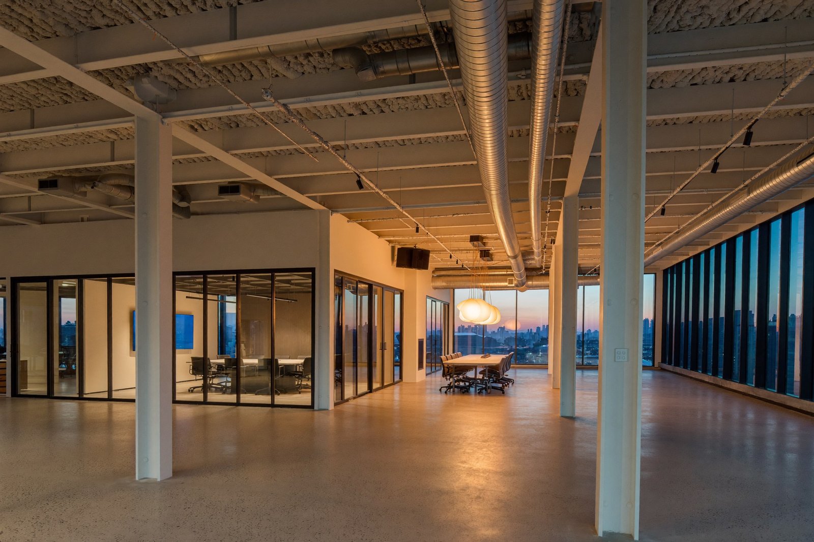 Finished modern office interior with exposed structure in a Dallas tenant build-out